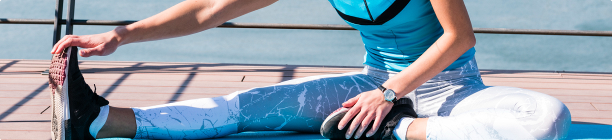 woman in activewear stretching